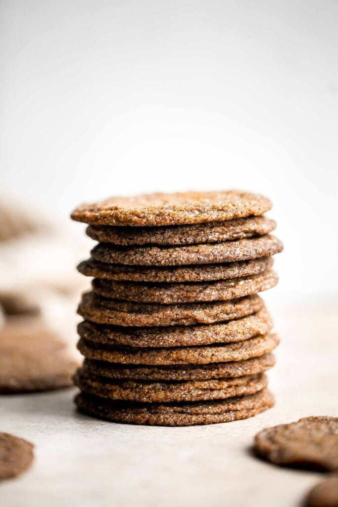 Thin crispy gingersnaps are a classic holiday cookie loaded with festive spices and molasses flavor. It's a no chill recipe that is quick and easy to make. | aheadofthyme.com