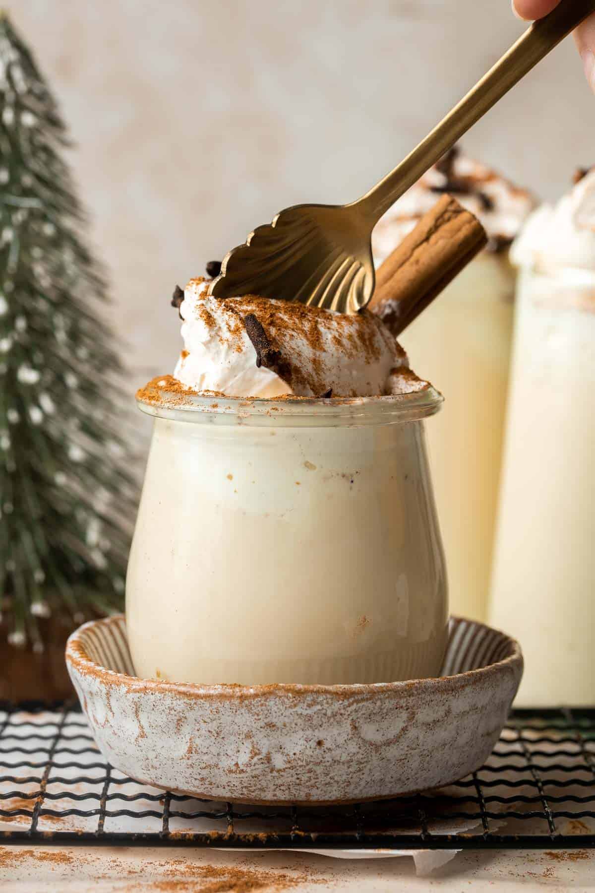 Non-alcoholic homemade eggnog is thick, sweet, creamy, and smooth. This family-friendly version of a classic holiday drink is way better than store-bought. | aheadofthyme.com