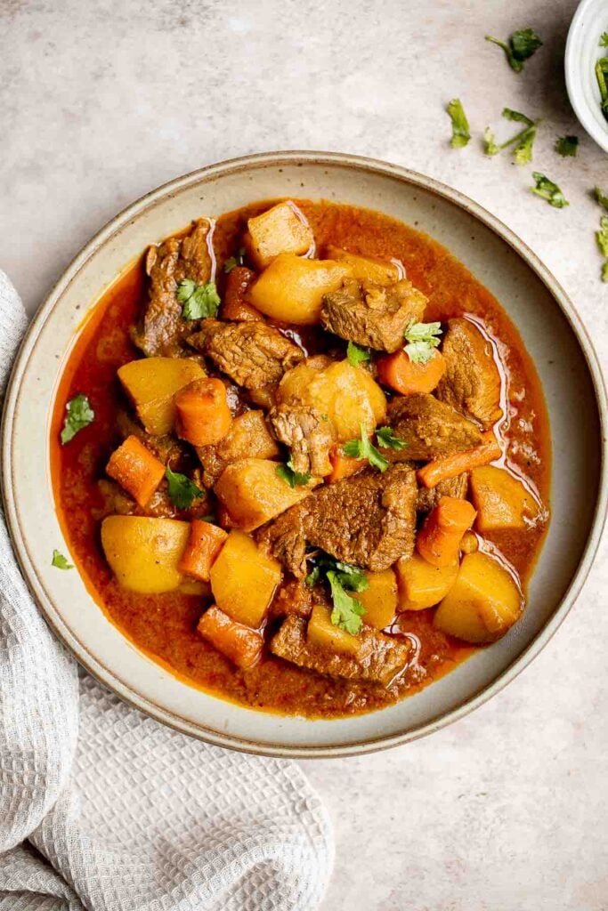 Instant pot beef curry with potatoes and carrots is delicious, hearty, comforting, and flavorful. It's made quick and easy in the pressure cooker. | aheadofthyme.com