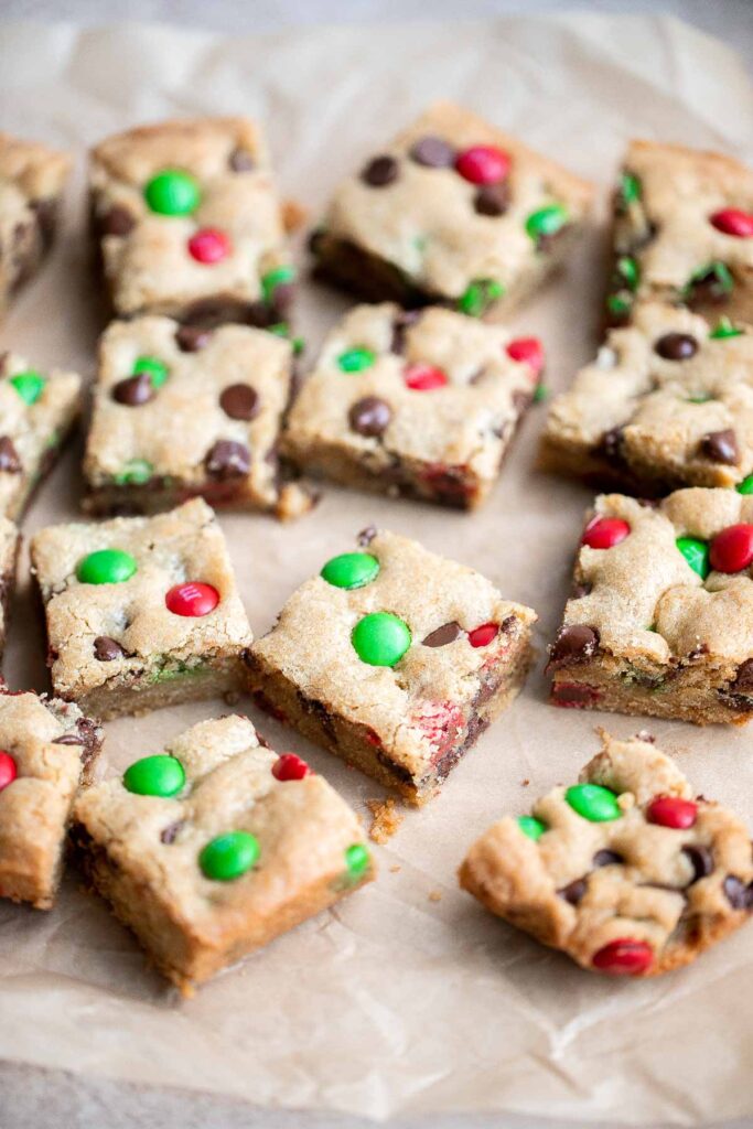 M&M cookie bars are soft and chewy, have crisp edges with a gooey center, and are loaded with M&M's and chocolate chips. The easiest way to bake cookies! | aheadofthyme.com