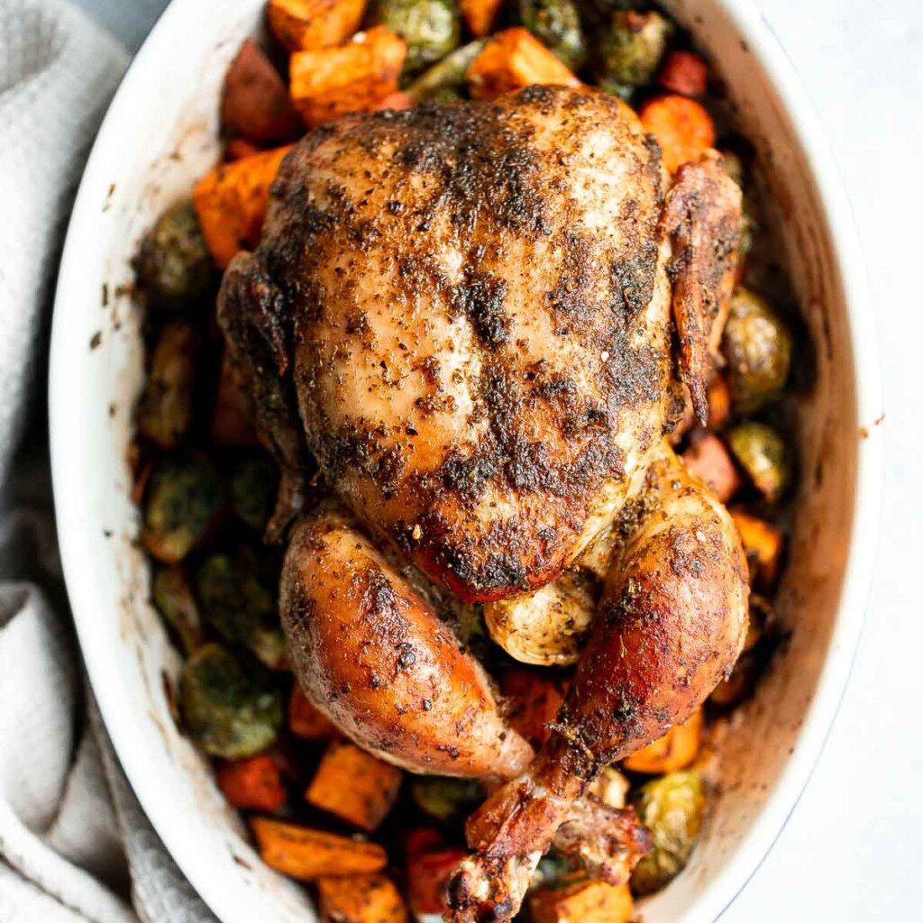 Pesto Roast Chicken is juicy, flavorful, and roasted with basil pesto over vegetables for an easy, one-pan dinner everyone loves. | aheadofthyme.com