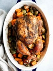 Pesto Roast Chicken is juicy, flavorful, and roasted with basil pesto over vegetables for an easy, one-pan dinner everyone loves. | aheadofthyme.com