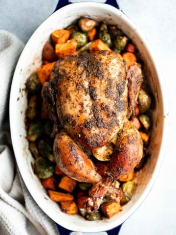Pesto Roast Chicken is juicy, flavorful, and roasted with basil pesto over vegetables for an easy, one-pan dinner everyone loves. | aheadofthyme.com