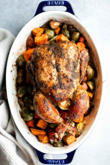 Pesto Roast Chicken is juicy, flavorful, and roasted with basil pesto over vegetables for an easy, one-pan dinner everyone loves. | aheadofthyme.com