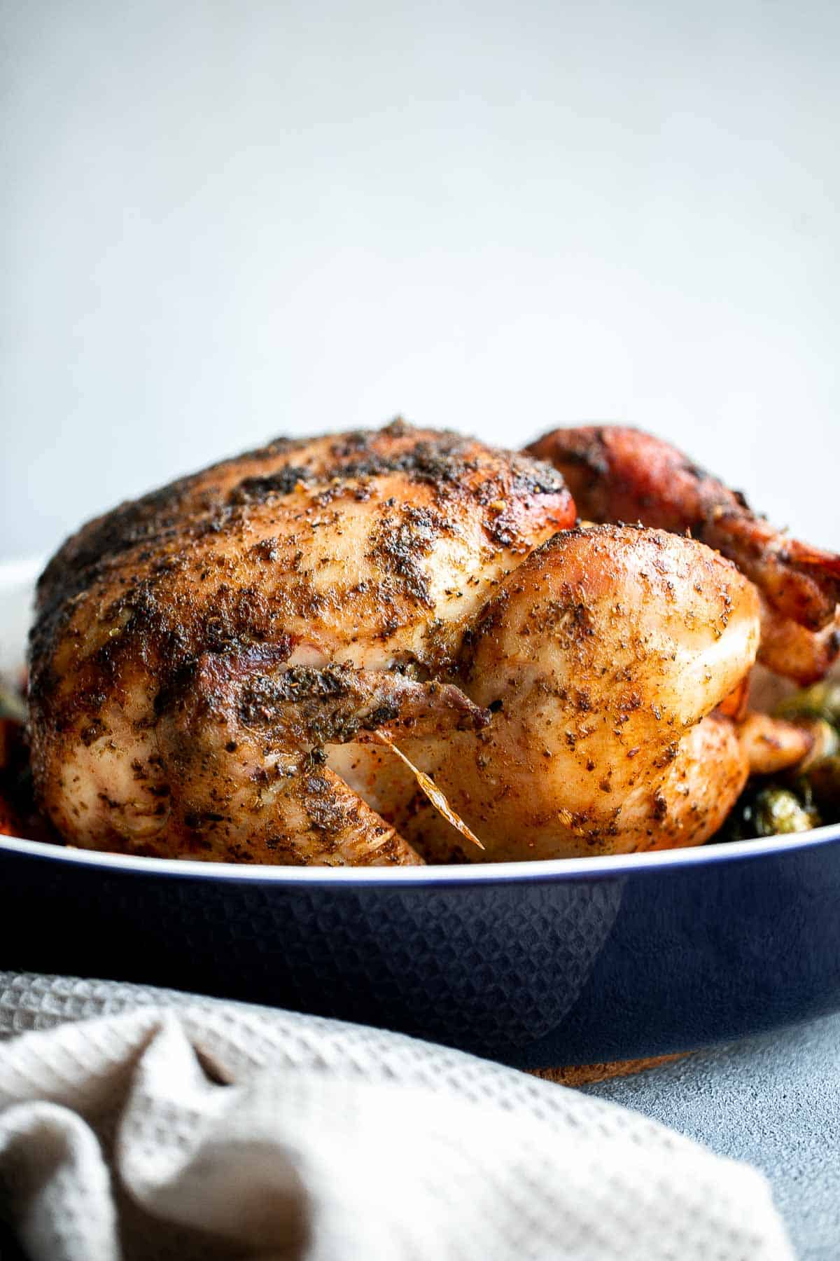 Pesto Roast Chicken is juicy, flavorful, and roasted with basil pesto over vegetables for an easy, one-pan dinner everyone loves. | aheadofthyme.com
