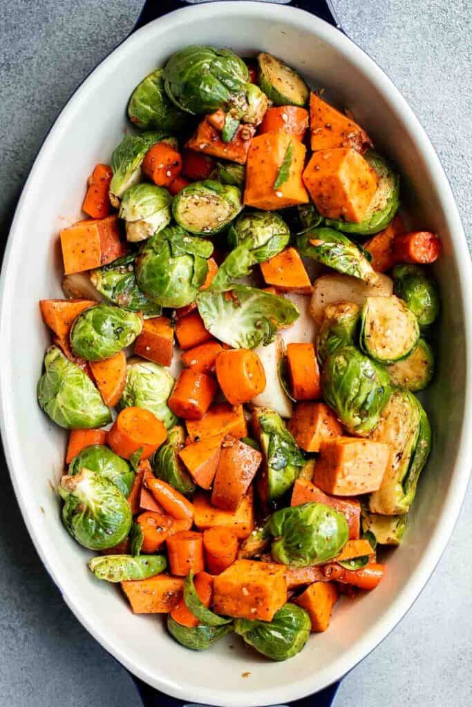 Pesto Roast Chicken is juicy, flavorful, and roasted with basil pesto over vegetables for an easy, one-pan dinner everyone loves. | aheadofthyme.com