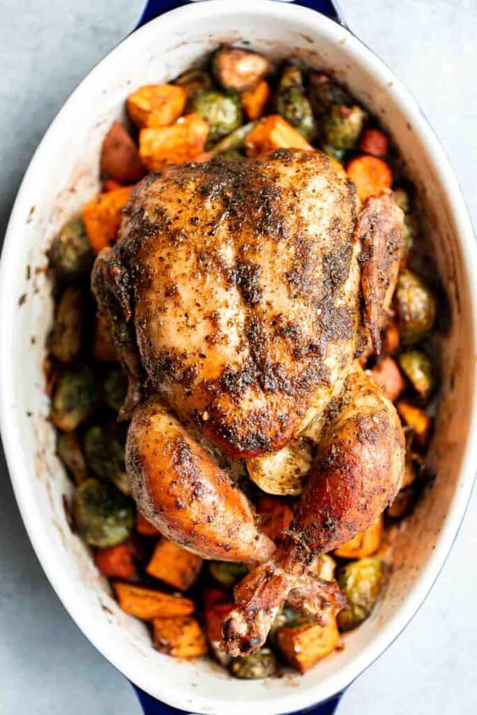 Pesto Roast Chicken is juicy, flavorful, and roasted with basil pesto over vegetables for an easy, one-pan dinner everyone loves. | aheadofthyme.com