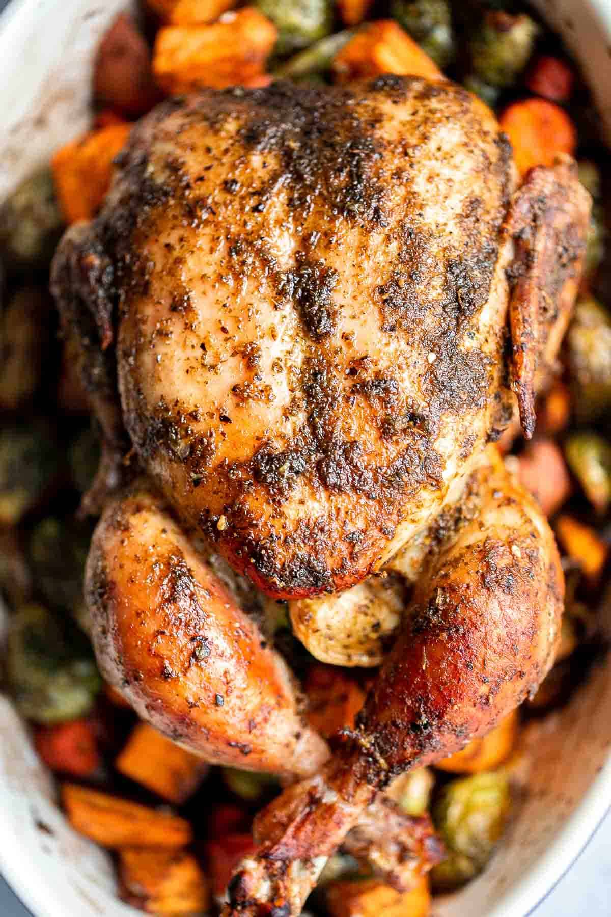 Pesto Roast Chicken is juicy, flavorful, and roasted with basil pesto over vegetables for an easy, one-pan dinner everyone loves. | aheadofthyme.com