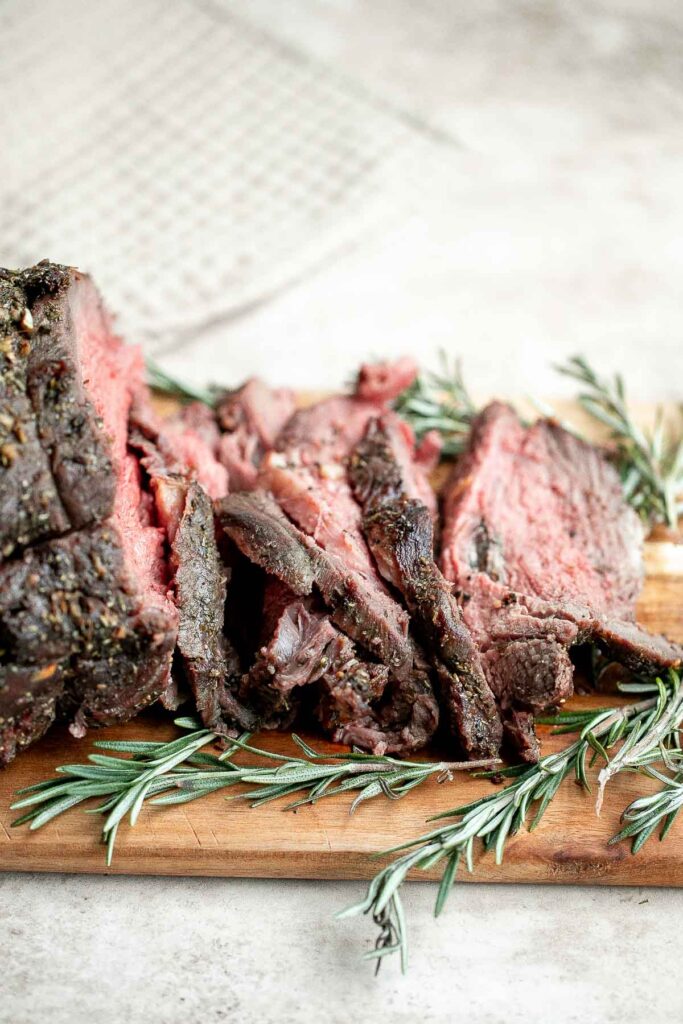 Homemade roast beef is roasted on high heat and slow cooked on low heat for the best texture — browned crust on the outside and tender, moist, juicy inside. | aheadofthyme.com