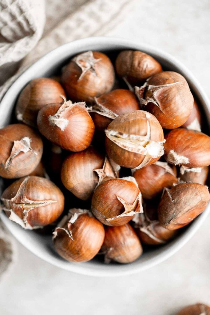 Enjoy street vendor roasted chestnuts at home in three different ways — roast in the oven, cook over the stove, or in the air fryer. | aheadofthyme.com