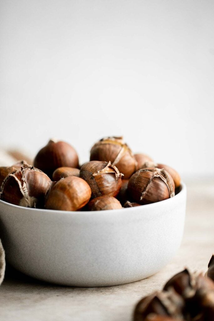 Enjoy street vendor roasted chestnuts at home in three different ways — roast in the oven, cook over the stove, or in the air fryer. | aheadofthyme.com