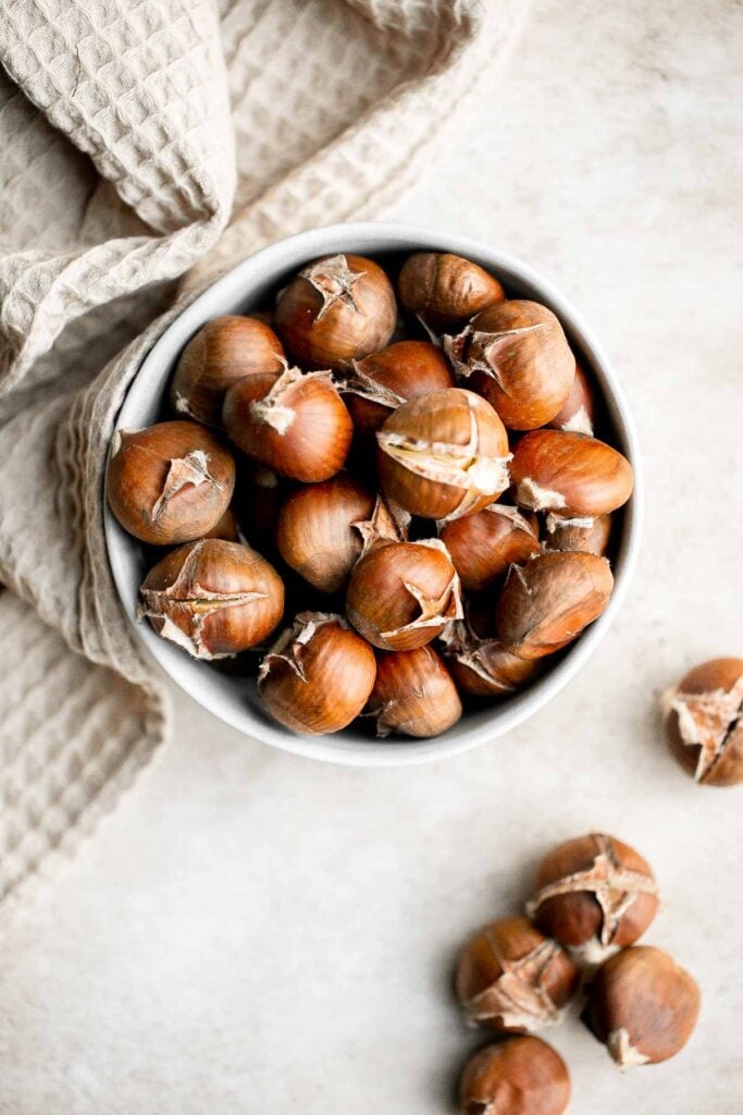 Enjoy street vendor roasted chestnuts at home in three different ways — roast in the oven, cook over the stove, or in the air fryer. | aheadofthyme.com