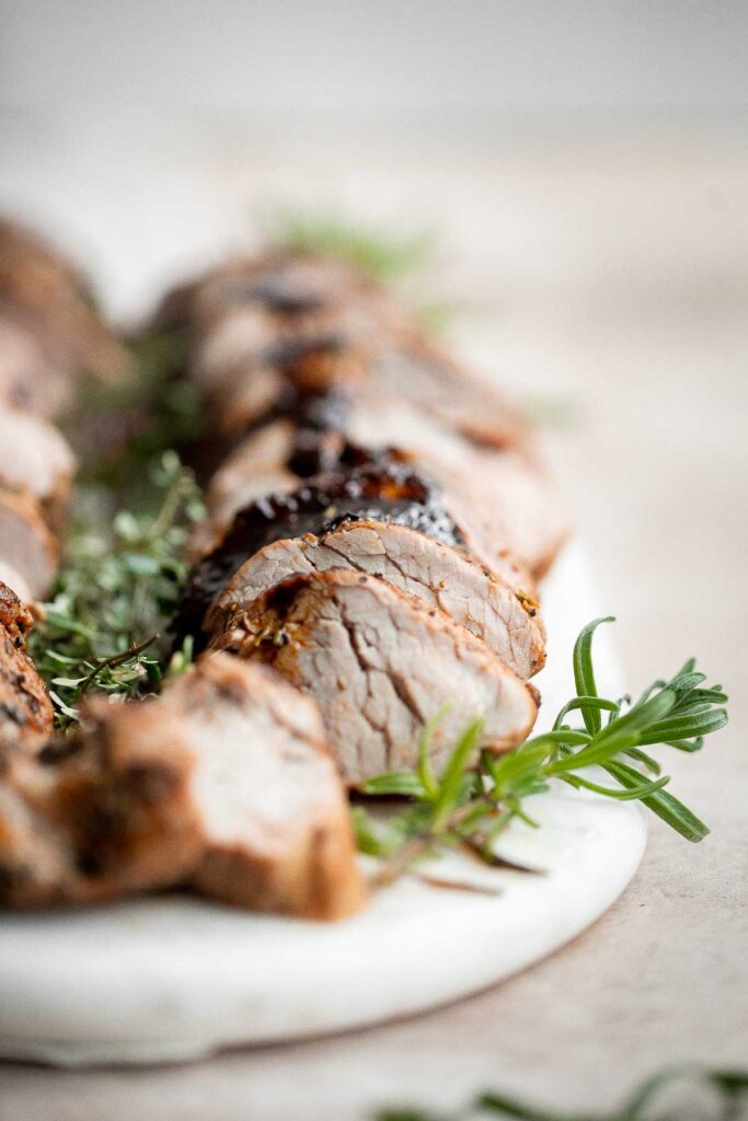 Quick easy roasted pork tenderloin with sauce is juicy, tender, and flavorful. Ready in 30 minutes, it's perfect for busy weeknights or a holiday dinner. | aheadofthyme.com