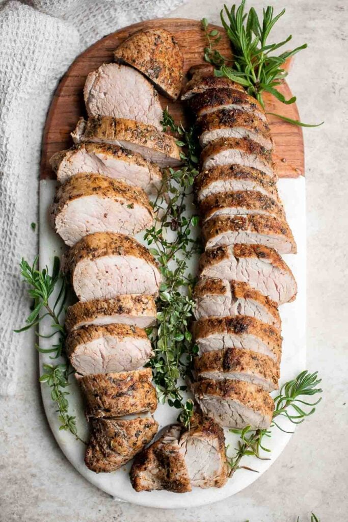 Quick easy roasted pork tenderloin with sauce is juicy, tender, and flavorful. Ready in 30 minutes, it's perfect for busy weeknights or a holiday dinner. | aheadofthyme.com