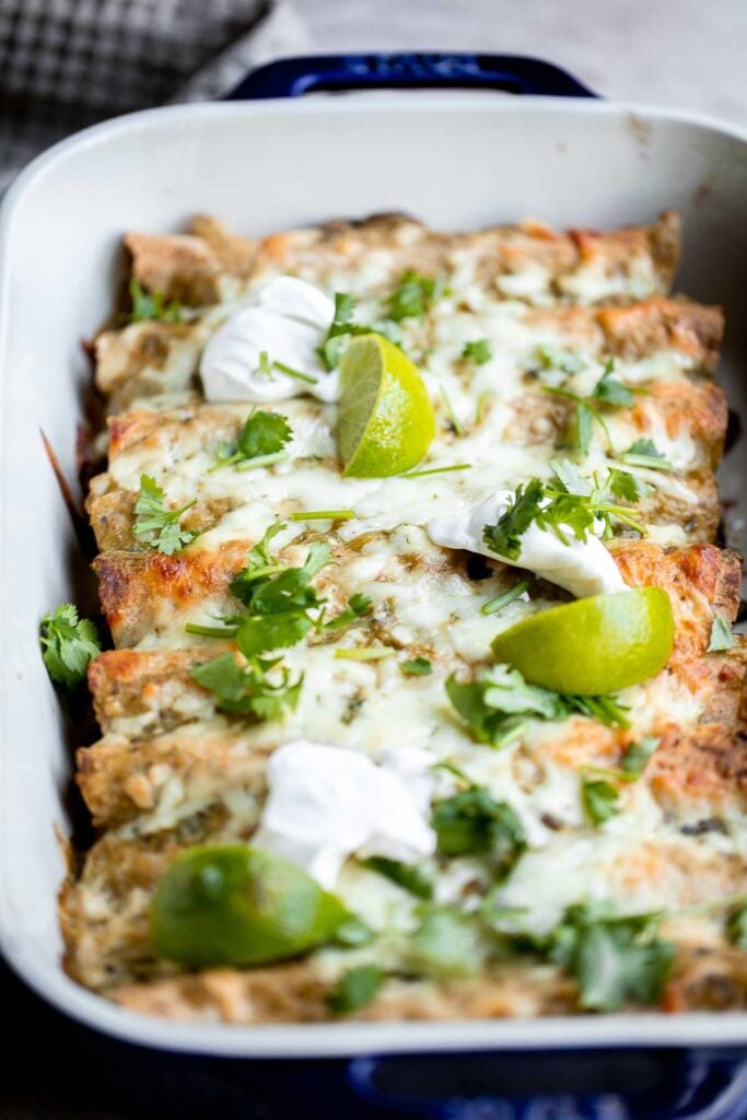 Salsa verde green chicken enchiladas are delicious and flavorful, quick and easy to make, and saucy and spicy. Authentic Mexican food ready in 40 minutes. | aheadofthyme.com