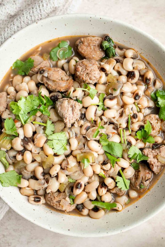 Southern Black Eyed Peas (Hoppin' John) is classic comfort food that is hearty, delicious, flavorful, and comforting. Serve it on New Year's for good luck. | aheadofthyme.com