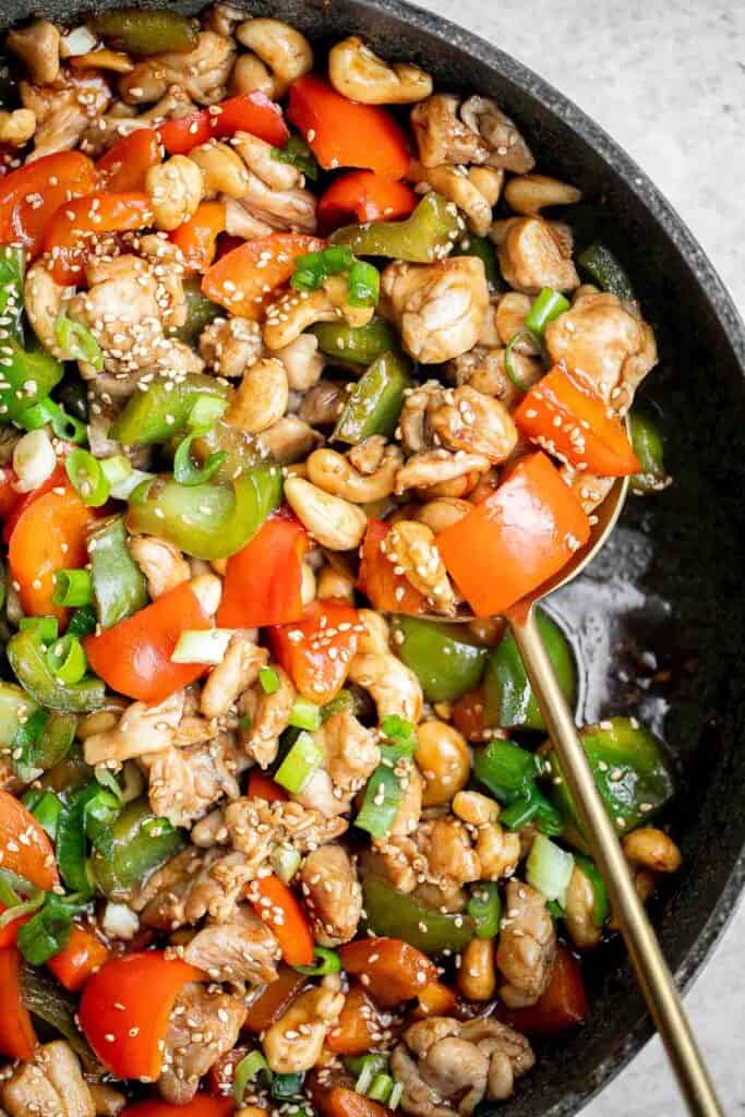 Cashew chicken is a quick and easy chicken stir fry ready in under 30 minutes. It's flavorful, delicious, and so much better and faster than takeout. | aheadofthyme.com