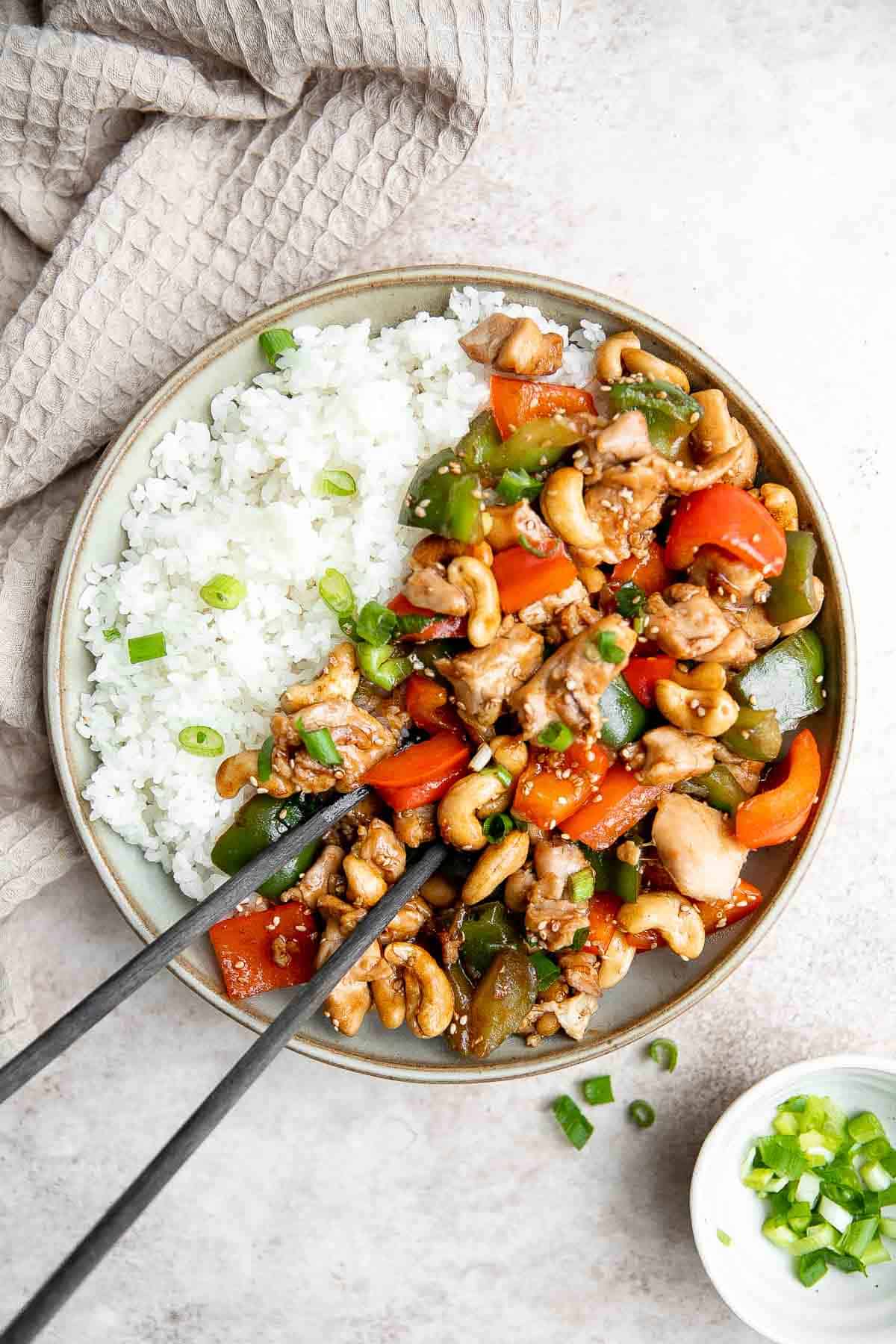 Cashew chicken is a quick and easy chicken stir fry ready in under 30 minutes. It's flavorful, delicious, and so much better and faster than takeout. | aheadofthyme.com