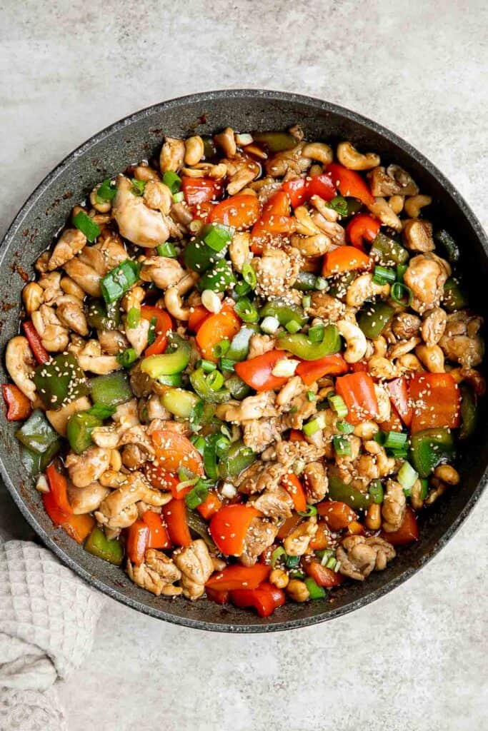 Cashew chicken is a quick and easy chicken stir fry ready in under 30 minutes. It's flavorful, delicious, and so much better and faster than takeout. | aheadofthyme.com