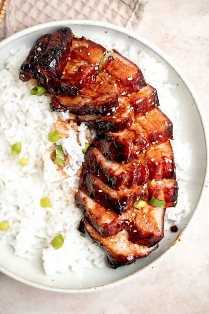 Char siu (Chinese BBQ pork) is a delicious, flavorful, traditional roasted pork dinner slathered in a distinct sticky, sweet, savory barbecue sauce glaze. | aheadofthyme.com