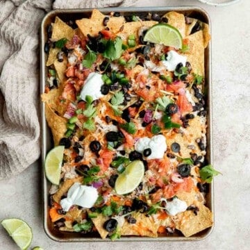 Chicken nachos are an easy to make when you’re craving something filling, crunchy, cheesy, and satisfying. Perfect game day appetizer or late-night snack. | aheadofthyme.com