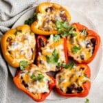 Leftover chili stuffed peppers are delicious, flavorful, and the easiest way to make stuffed peppers, with only three ingredients and five minutes of prep. | aheadofthyme.com