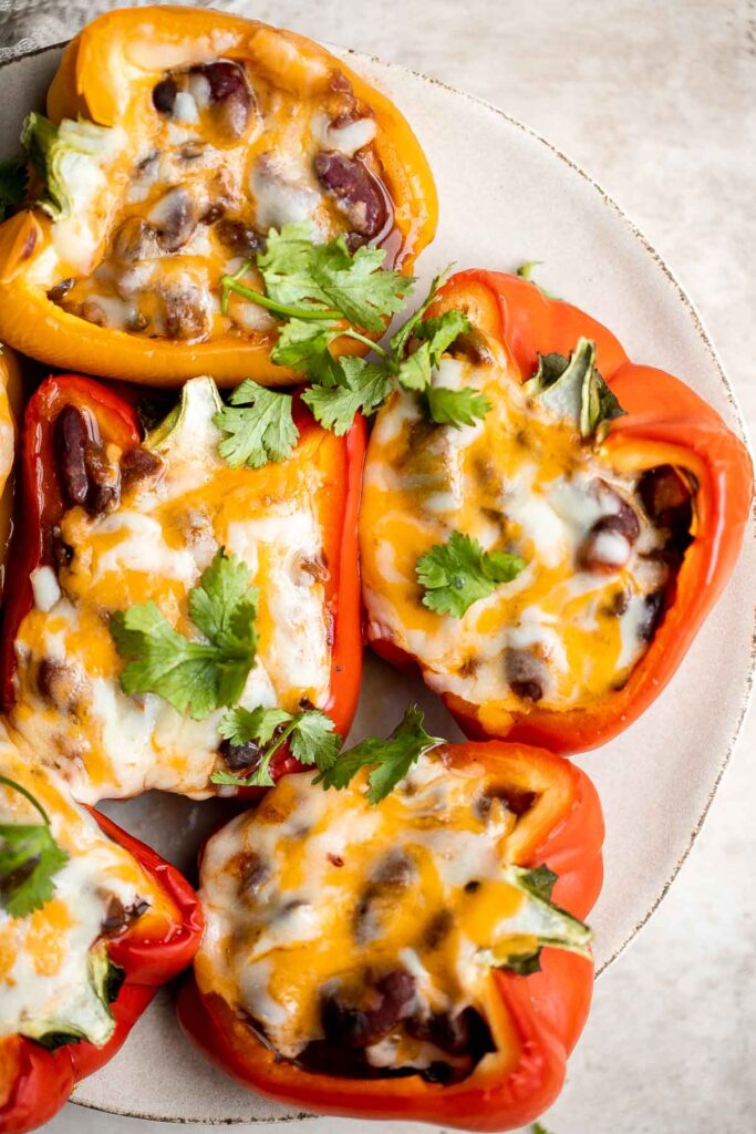 Leftover chili stuffed peppers are delicious, flavorful, and the easiest way to make stuffed peppers, with only three ingredients and five minutes of prep. | aheadofthyme.com