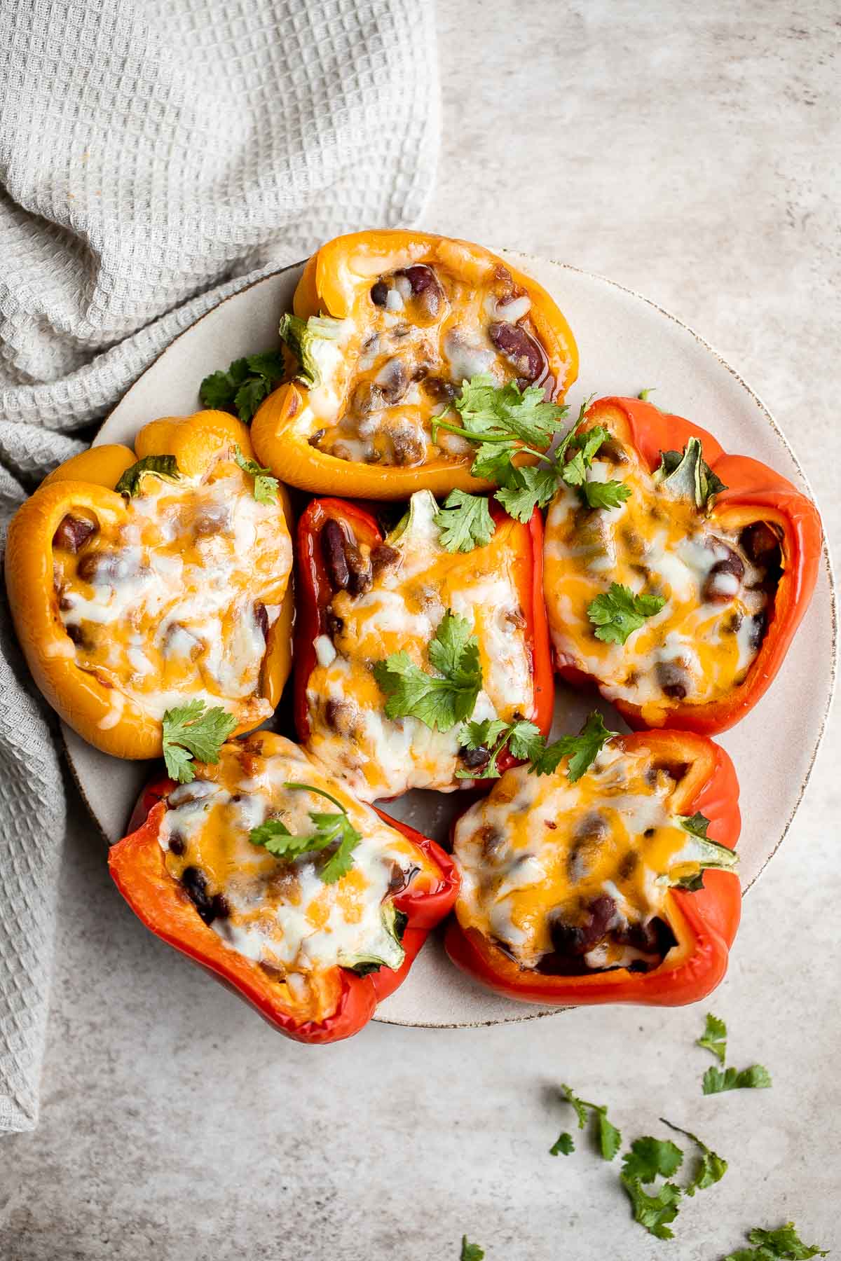 Leftover chili stuffed peppers are delicious, flavorful, and the easiest way to make stuffed peppers, with only three ingredients and five minutes of prep. | aheadofthyme.com