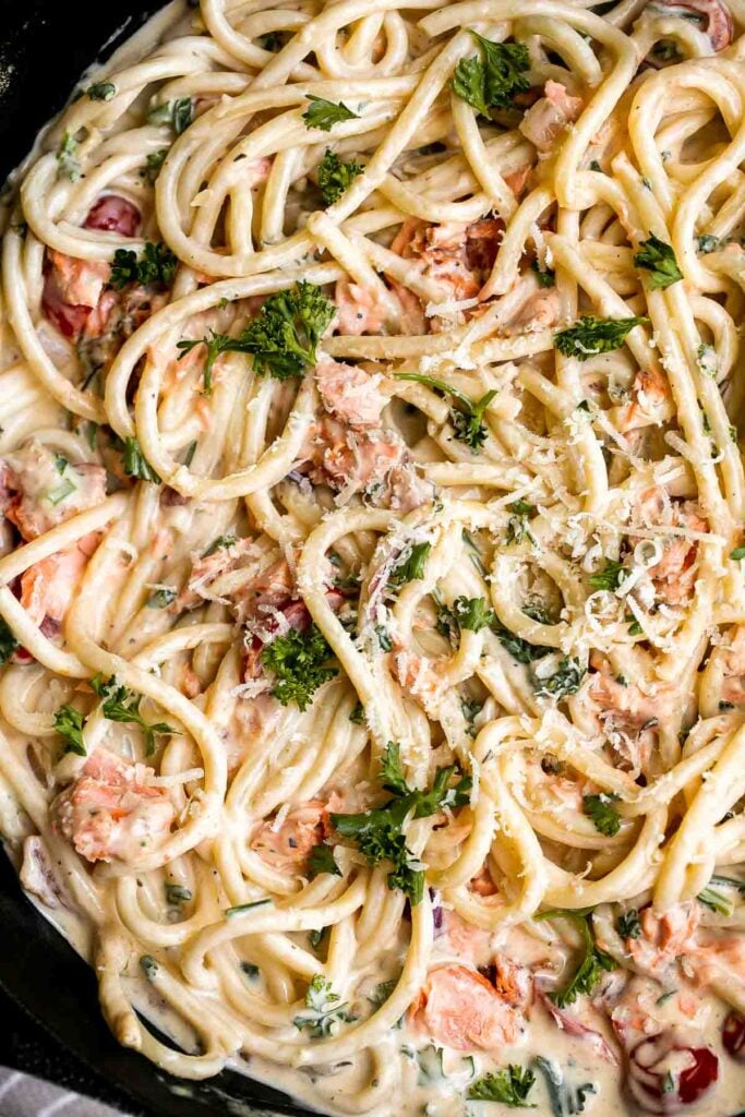 This simple creamy salmon pasta is quick and easy to make, delicious and flavorful, and loaded with salmon. A weeknight dinner in under 30 minutes. | aheadofthyme.com