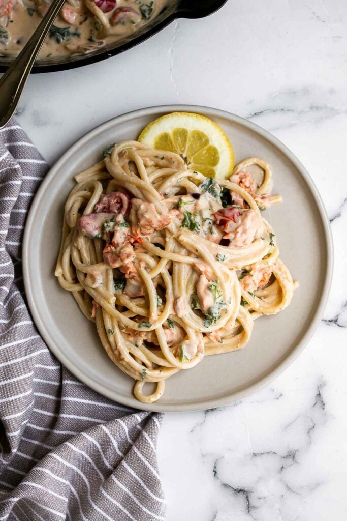 This simple creamy salmon pasta is quick and easy to make, delicious and flavorful, and loaded with salmon. A weeknight dinner in under 30 minutes. | aheadofthyme.com