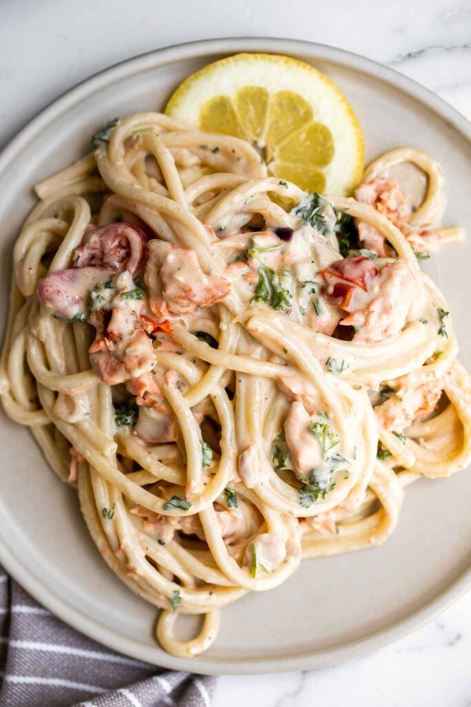 This simple creamy salmon pasta is quick and easy to make, delicious and flavorful, and loaded with salmon. A weeknight dinner in under 30 minutes. | aheadofthyme.com