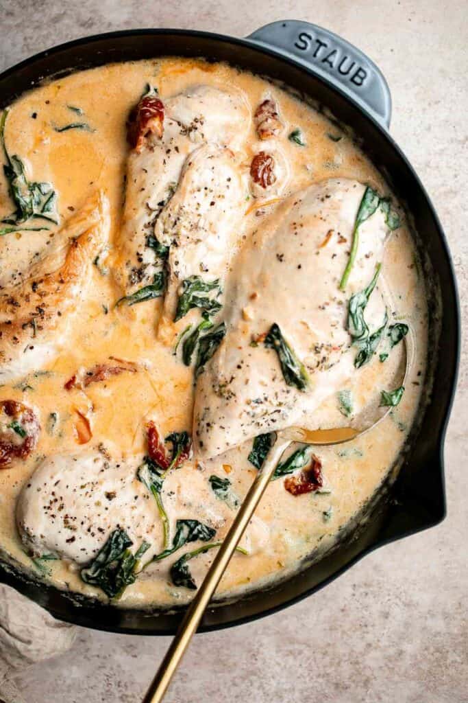 Creamy Tuscan chicken with sun-dried tomatoes and spinach is a quick and easy 30 minute Italian chicken dinner that is delicious, flavorful, and comforting. | aheadofthyme.com