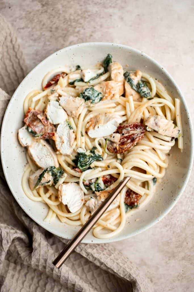 Creamy Tuscan chicken with sun-dried tomatoes and spinach is a quick and easy 30 minute Italian chicken dinner that is delicious, flavorful, and comforting. | aheadofthyme.com