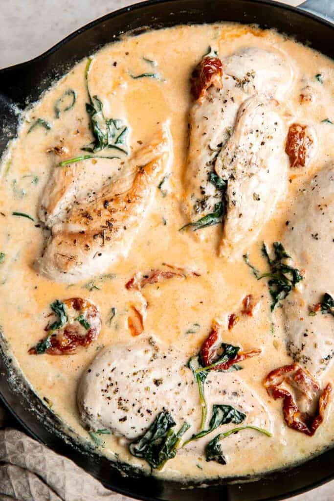 Creamy Tuscan chicken with sun-dried tomatoes and spinach is a quick and easy 30 minute Italian chicken dinner that is delicious, flavorful, and comforting. | aheadofthyme.com