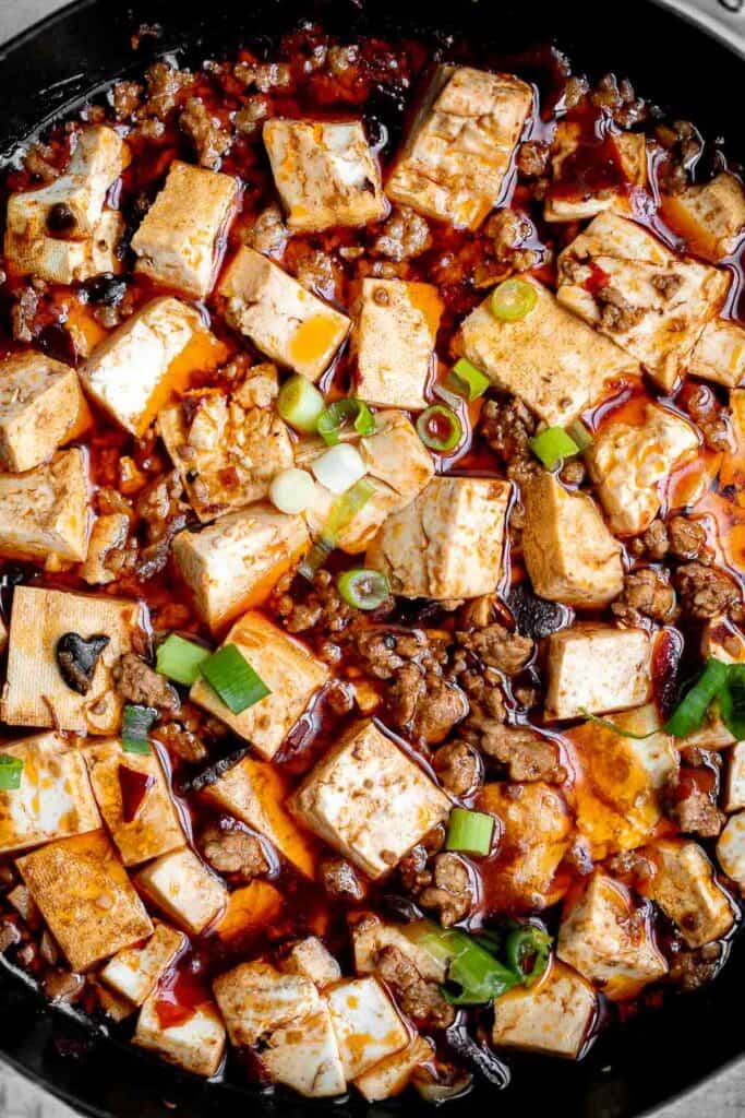 Mapo tofu is quick, easy, delicious, flavorful, spicy, and numbing that is ready in just 20 minutes. Serve it with steamed rice on busy weeknights. | aheadofthyme.com