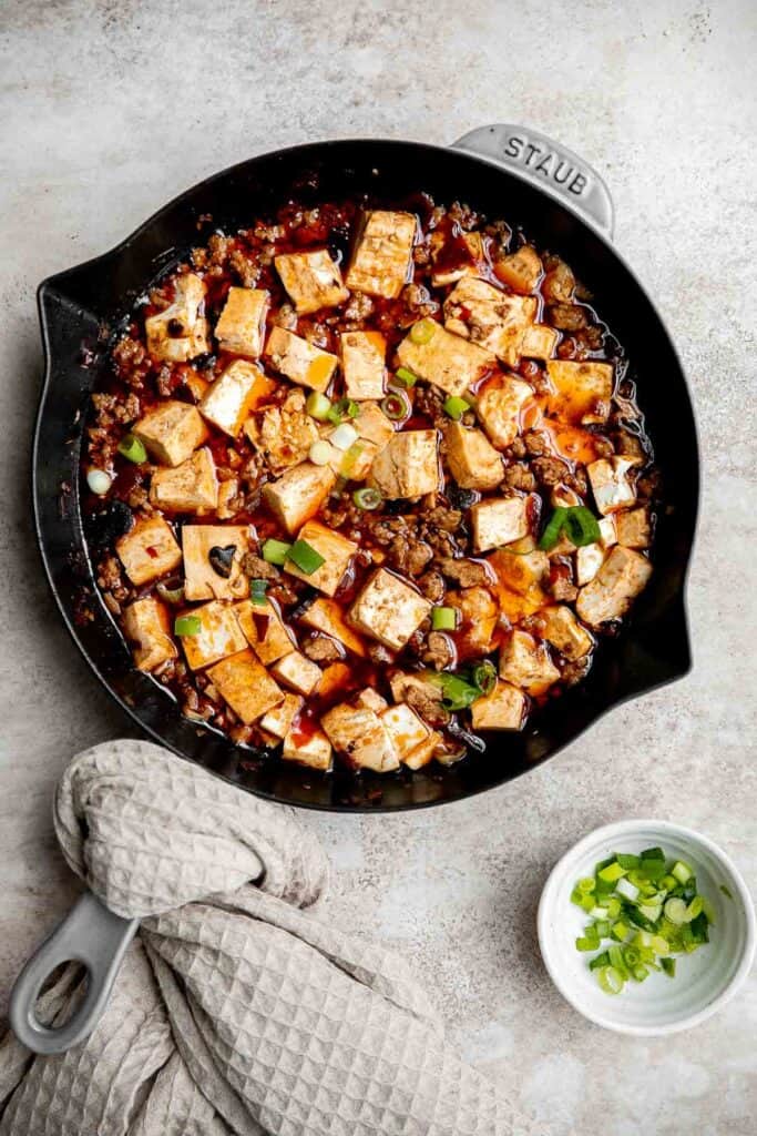 Mapo tofu is quick, easy, delicious, flavorful, spicy, and numbing that is ready in just 20 minutes. Serve it with steamed rice on busy weeknights. | aheadofthyme.com