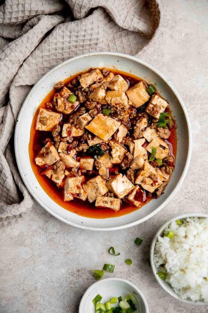 Mapo tofu is quick, easy, delicious, flavorful, spicy, and numbing that is ready in just 20 minutes. Serve it with steamed rice on busy weeknights. | aheadofthyme.com