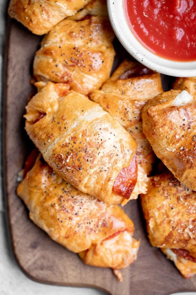 Pizza crescent rolls are a delicious, cheesy, easy appetizer ready in under 30 minutes — the perfect last minute bite, lunch or dinner, or game day appy. | aheadofthyme.com