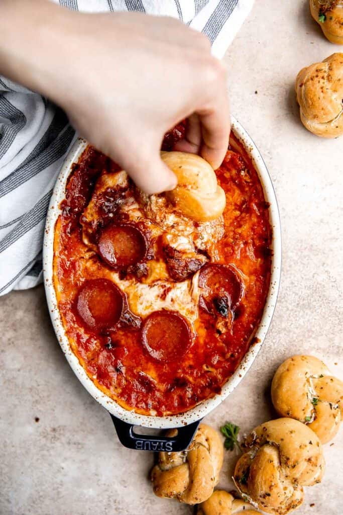 Pepperoni pizza dip is creamy, rich, comforting, and delicious. This appetizer is easy to make, easy to prepare ahead of time, and easy to eat. | aheadofthyme.com