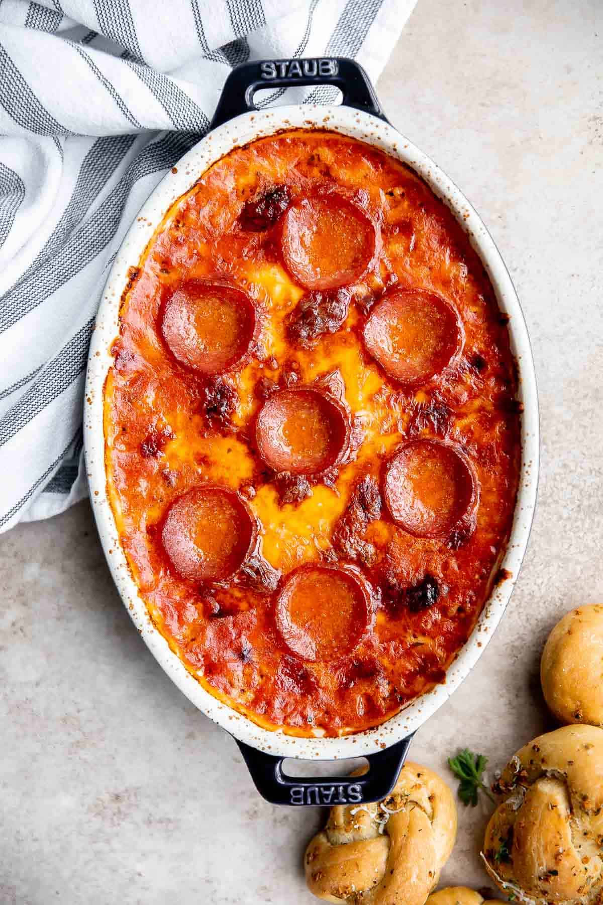 Pepperoni pizza dip is creamy, rich, comforting, and delicious. This appetizer is easy to make, easy to prepare ahead of time, and easy to eat. | aheadofthyme.com