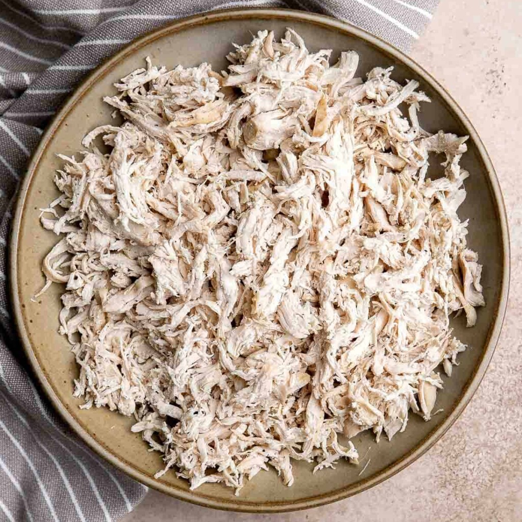 Shredded chicken is quick and easy to make (in three ways) and shred. It’s a staple ingredient to add to other recipes such as soup, salads, and sandwiches. | aheadofthyme.com