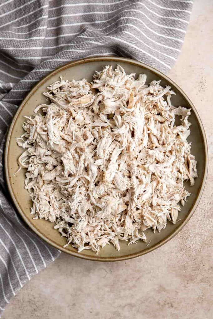 Shredded chicken is quick and easy to make (in three ways) and shred. It's a staple ingredient to add to other recipes such as soup, salads, and sandwiches. | aheadofthyme.com