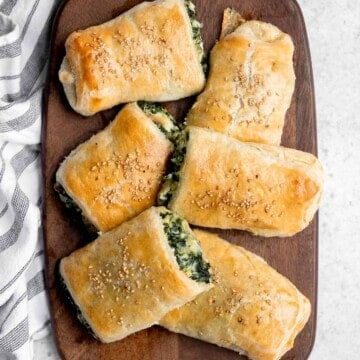 Spinach cheese rolls are an easy appetizer that's creamy, cheesy, comforting, and delicious. Serve as an appy at parties, for a school lunch, or snack. | aheadofthyme.com