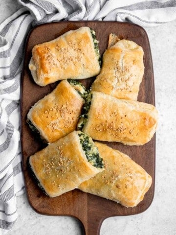 Spinach cheese rolls are an easy appetizer that's creamy, cheesy, comforting, and delicious. Serve as an appy at parties, for a school lunch, or snack. | aheadofthyme.com