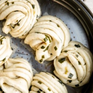 Steamed scallion buns (hua juan 花卷) are delicious flower rolls made of a light and fluffy dough layered with green onions that is twisted and steamed. | aheadofthyme.com