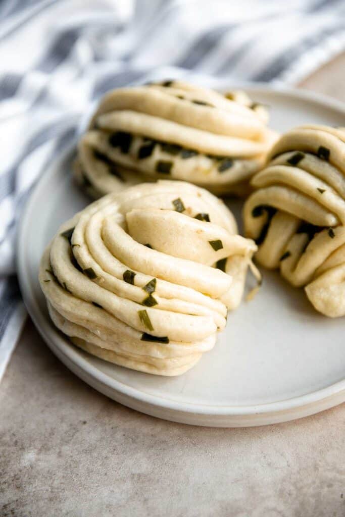 Steamed scallion buns (hua juan 花卷) are delicious flower rolls made of a light and fluffy dough layered with green onions that is twisted and steamed. | aheadofthyme.com