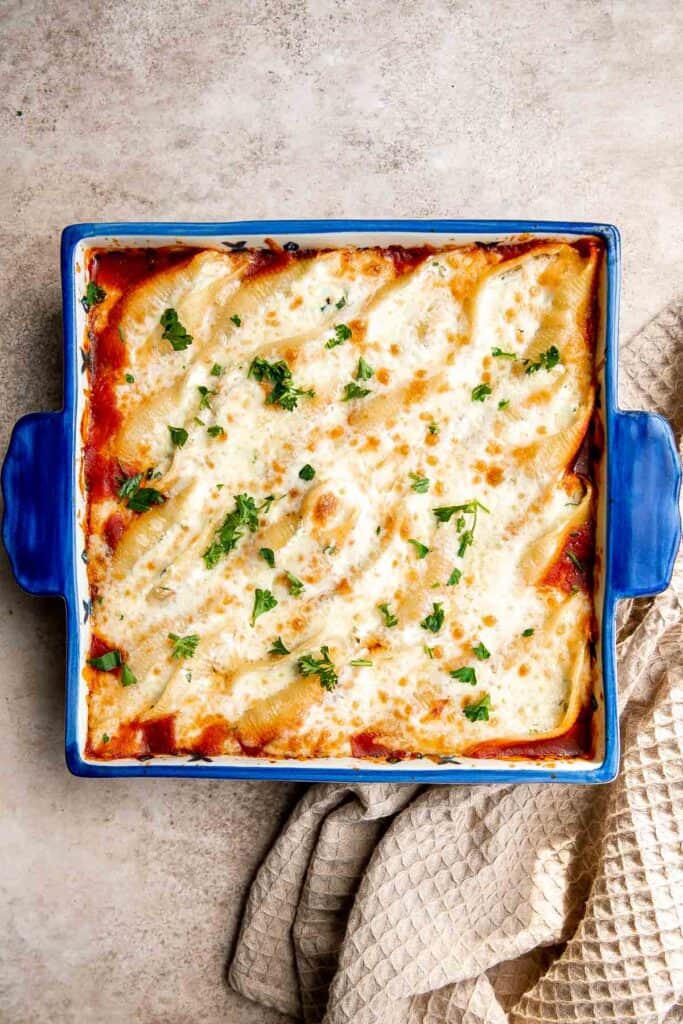 Ricotta stuffed shells are an easy, hearty, and classic Italian comfort food that can feed the whole family. Easy to make ahead and freeze for another day. | aheadofthyme.com