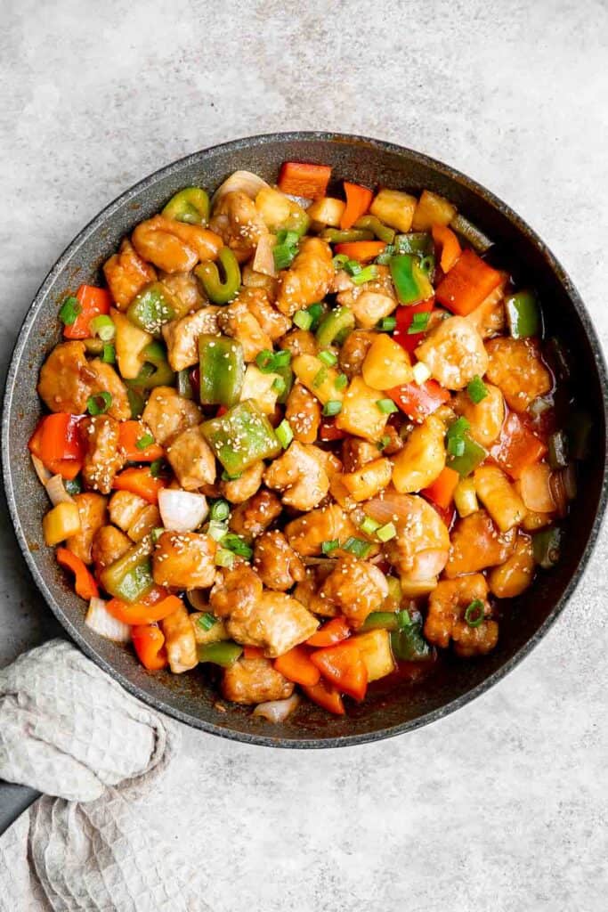 Sweet and sour pork is a delicious, quick and easy Chinese stir fry that takes just 30 minutes to make. Serve this homemade takeout over steamed rice. | aheadofthyme.com
