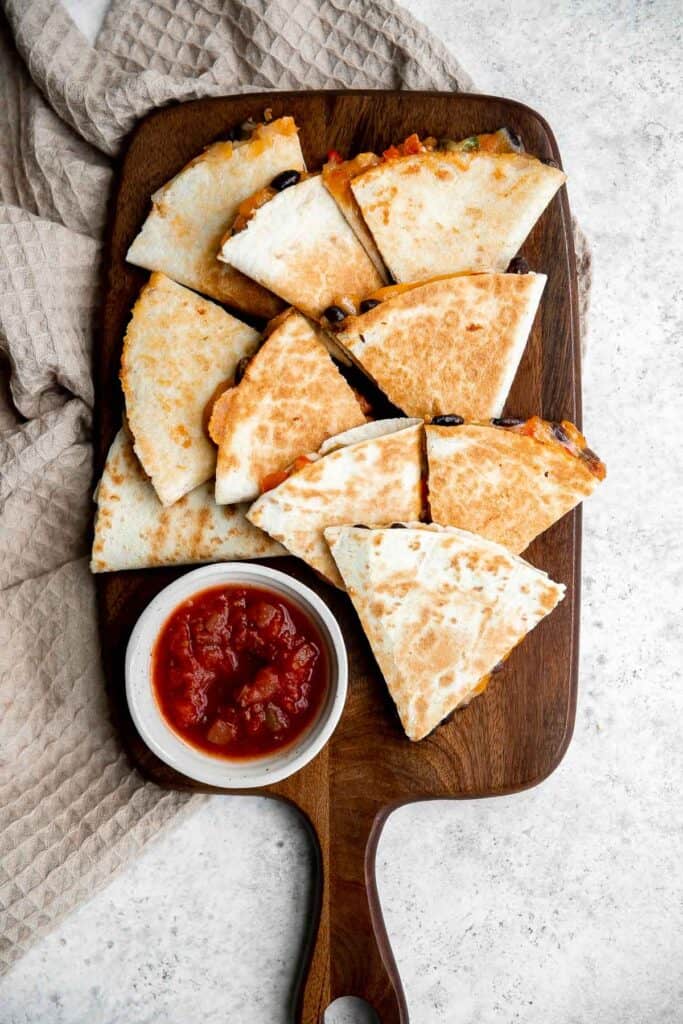 Vegetarian quesadillas are quick and easy, completely customizable, loaded with veggies and beans. Serve this kid-friendly Mexican meal for lunch or dinner. | aheadofthyme.com