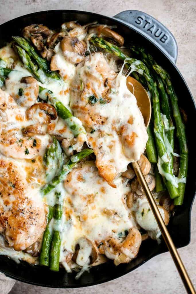 Chicken Madeira with sautéed mushrooms and tender crisp asparagus is topped with melty mozzarella cheese. Cheaper and better than the Cheesecake Factory! | aheadofthyme.com
